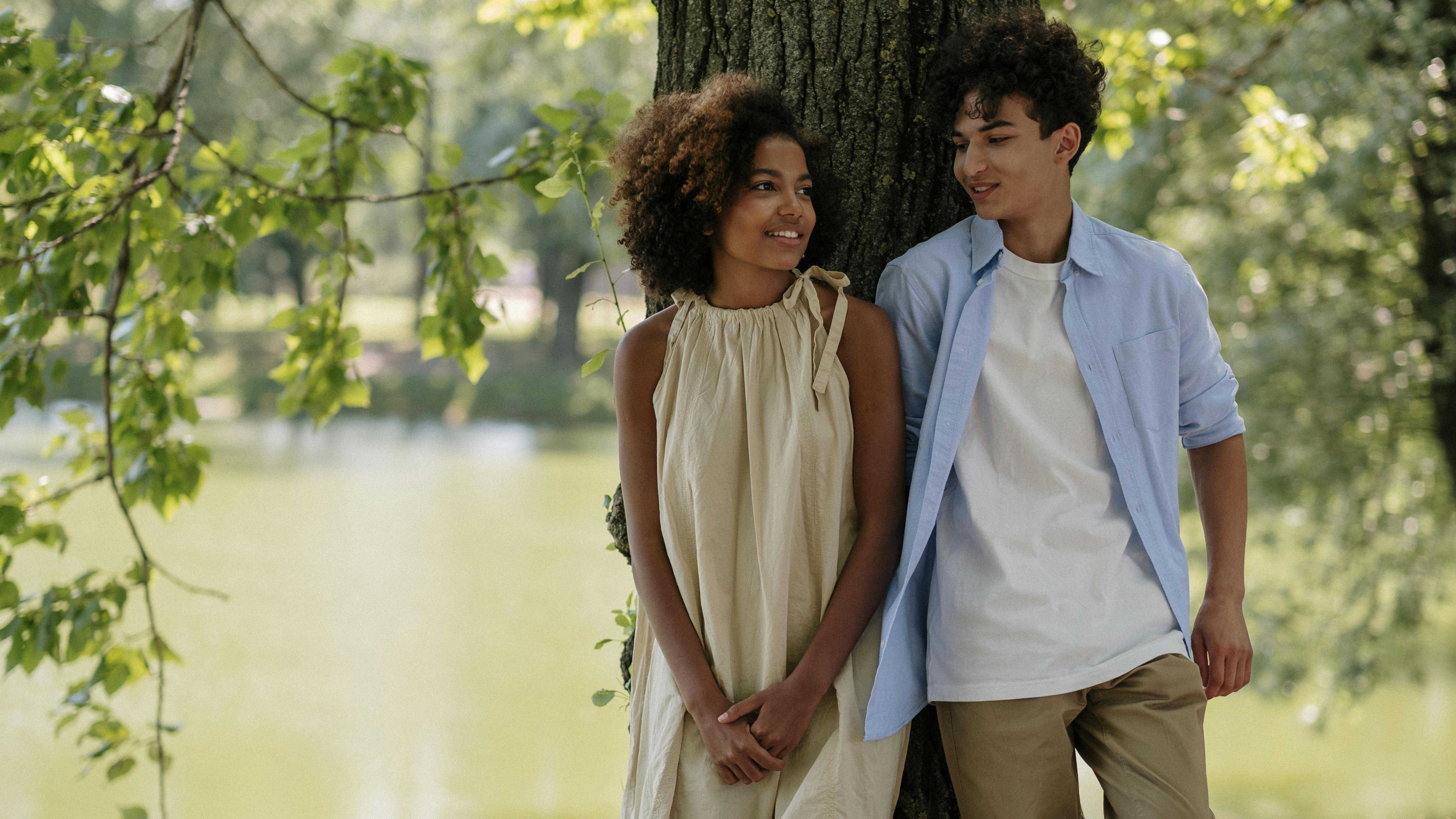 Thoughtful teenage communication concept with a young male indoors.