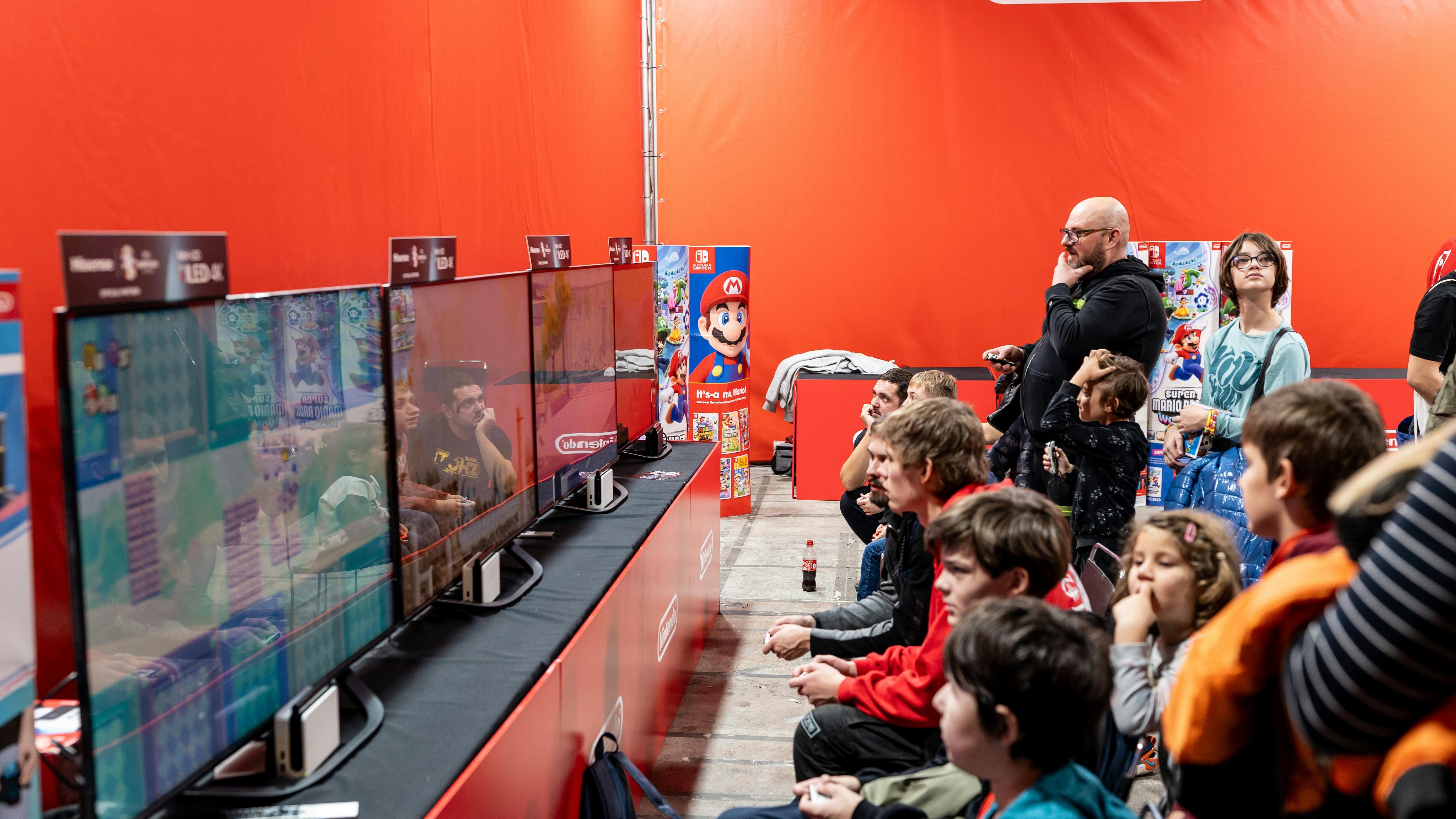 New Super Mario Bros. U Deluxe characters in vibrant scene.