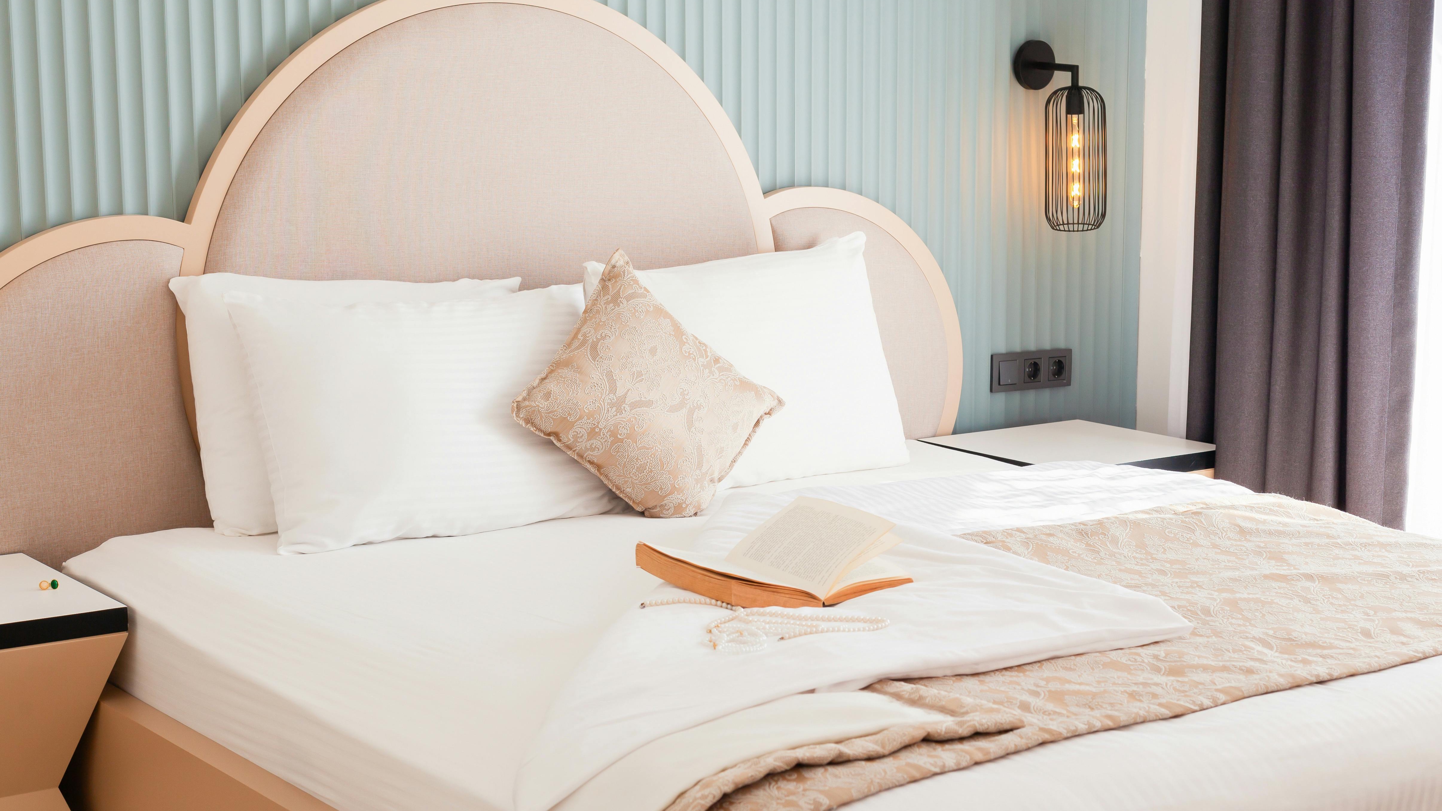 Serene classic bedroom ideal for remote work, featuring elegant decor and a fireplace.