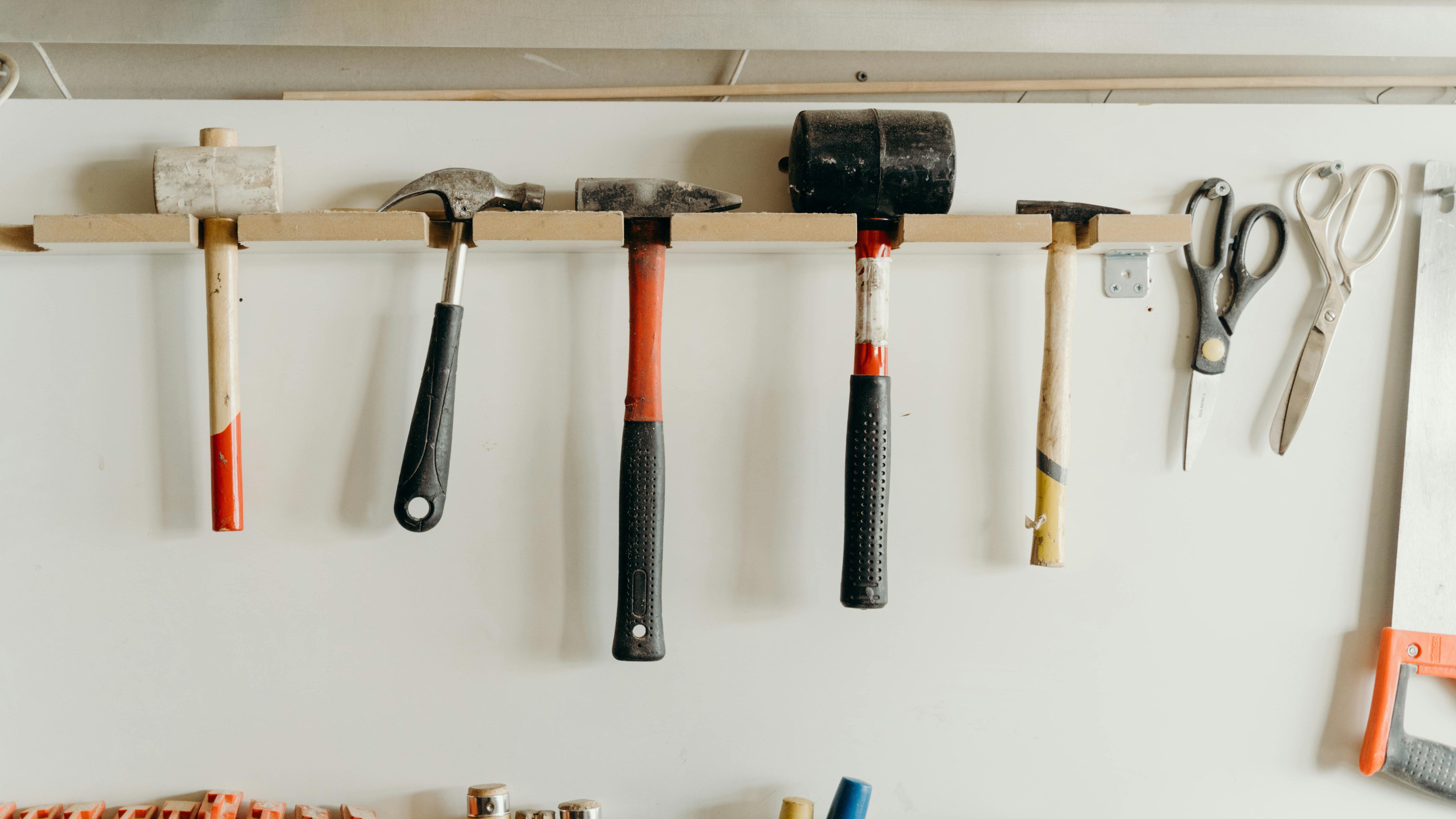 DIY miter saw jig with blue clamp for precise cutting.