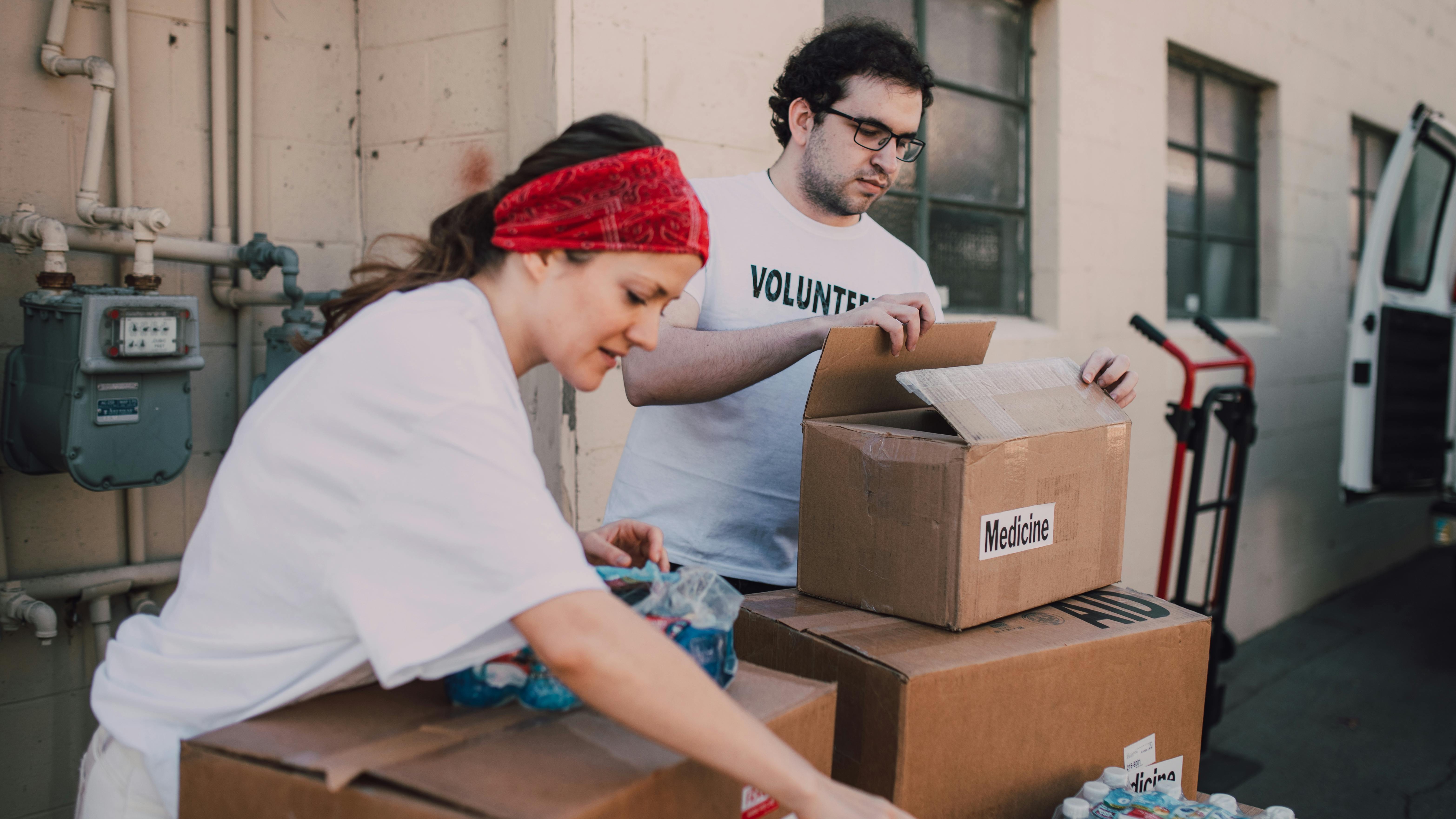Volunteers organizing food, showcasing Omaha nonprofits community impact.