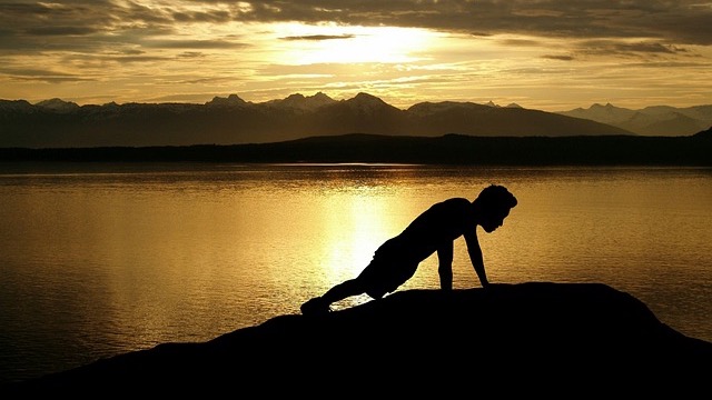 Men playing hooverball outdoors, vintage photo.