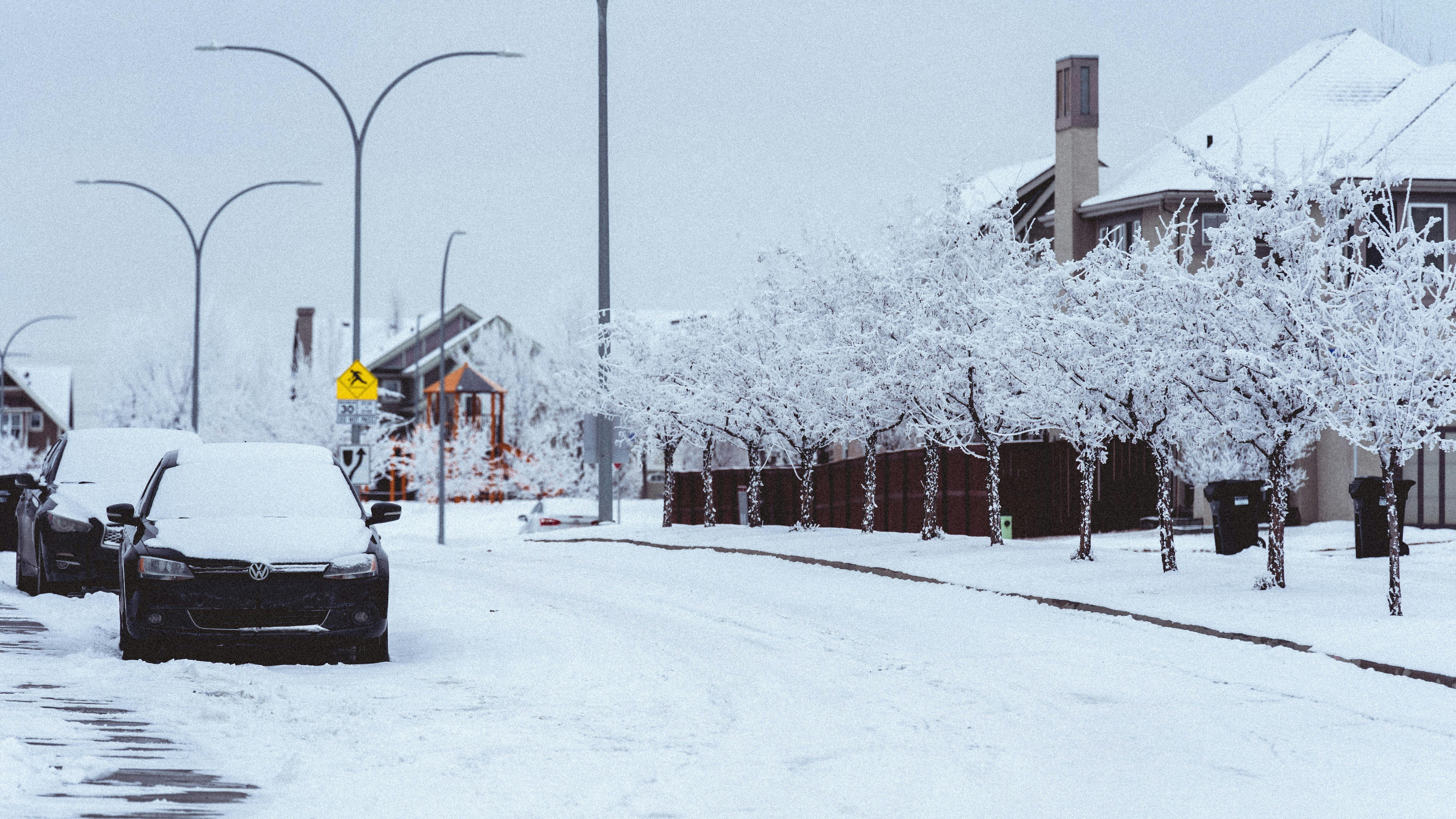 HR preparedness for winter storms: cars on snow-covered road.