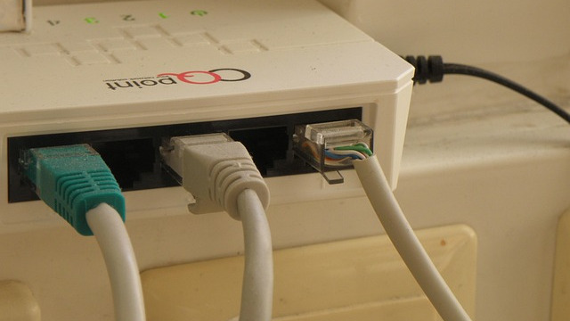 Young boy using laptop with free unlimited fiber internet at home.