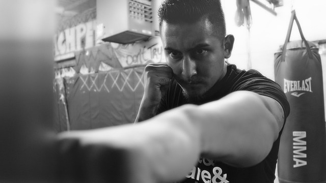 UFC fan experience with fighter entering the brightly lit arena.