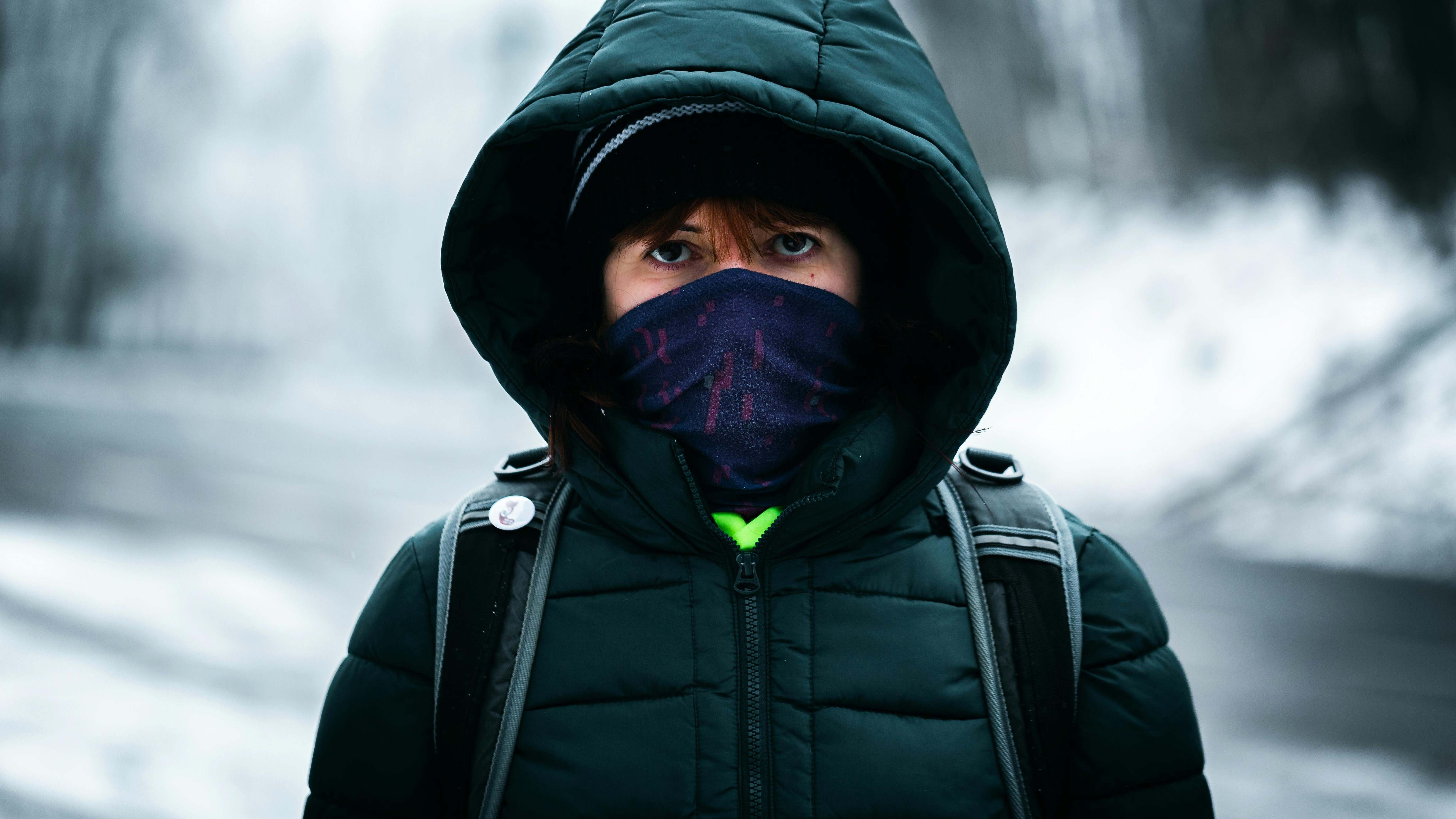 Project Warmth coat drive scene with people loading donations into SUV.