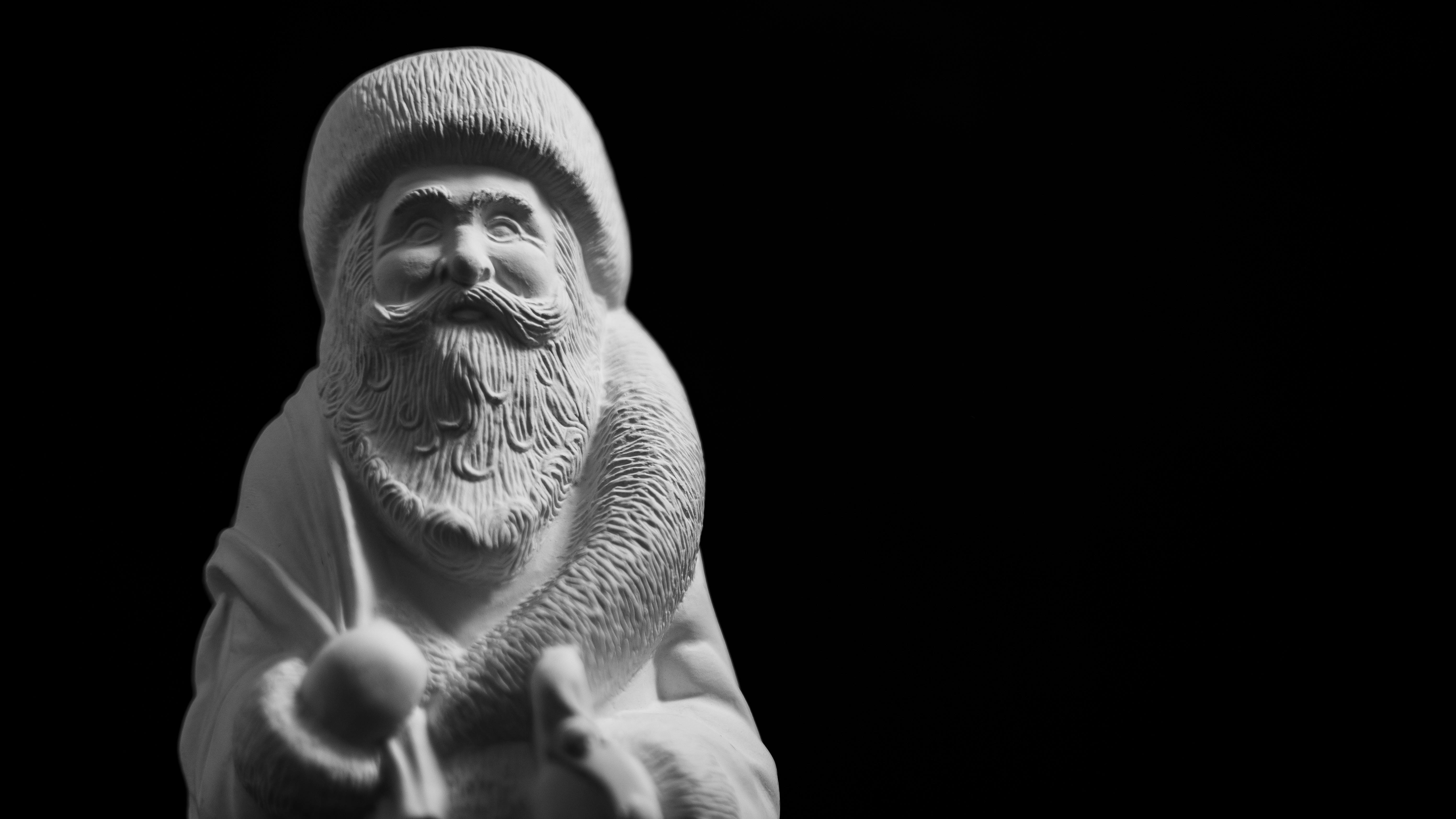 Santa in front of aircraft on Air Force runway for holiday theme.