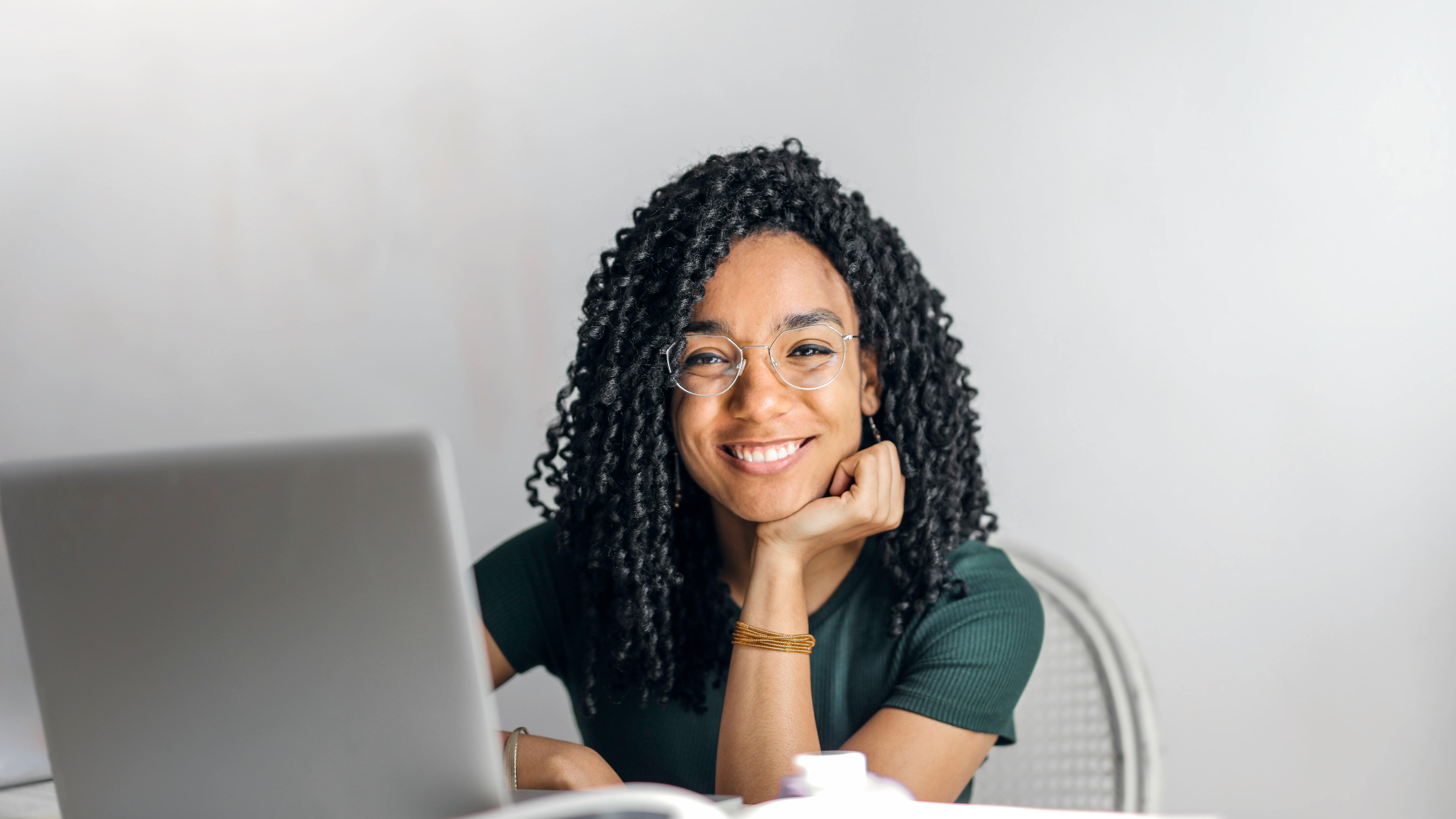 Generative AI increases hiring; tech professionals working in office.