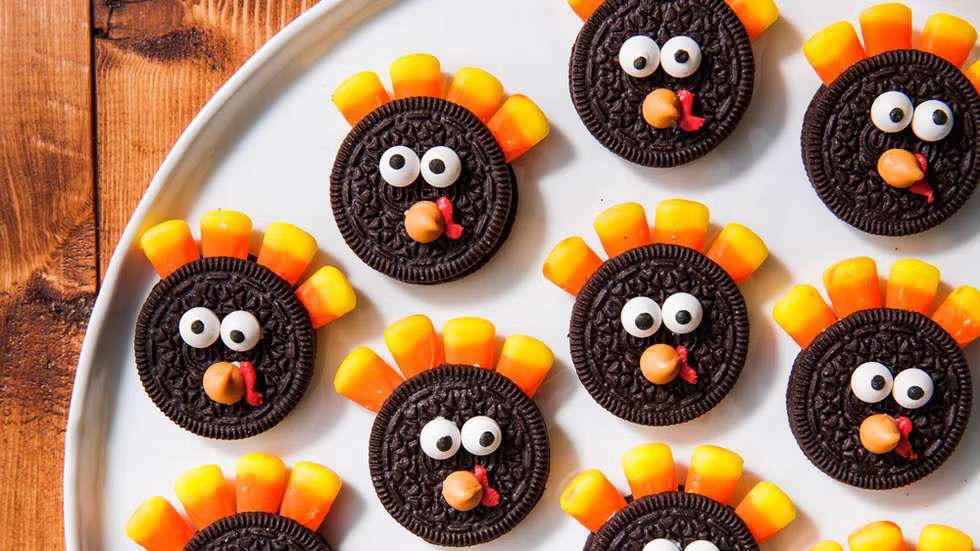 Thanksgiving Oreo Turkey Treats with candy corn and decorations.