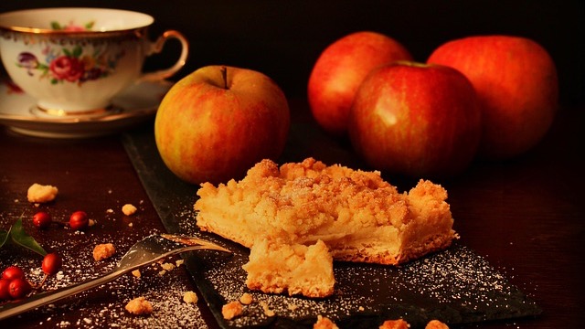 Slice of easy apple cake on a plate with pink fork.
