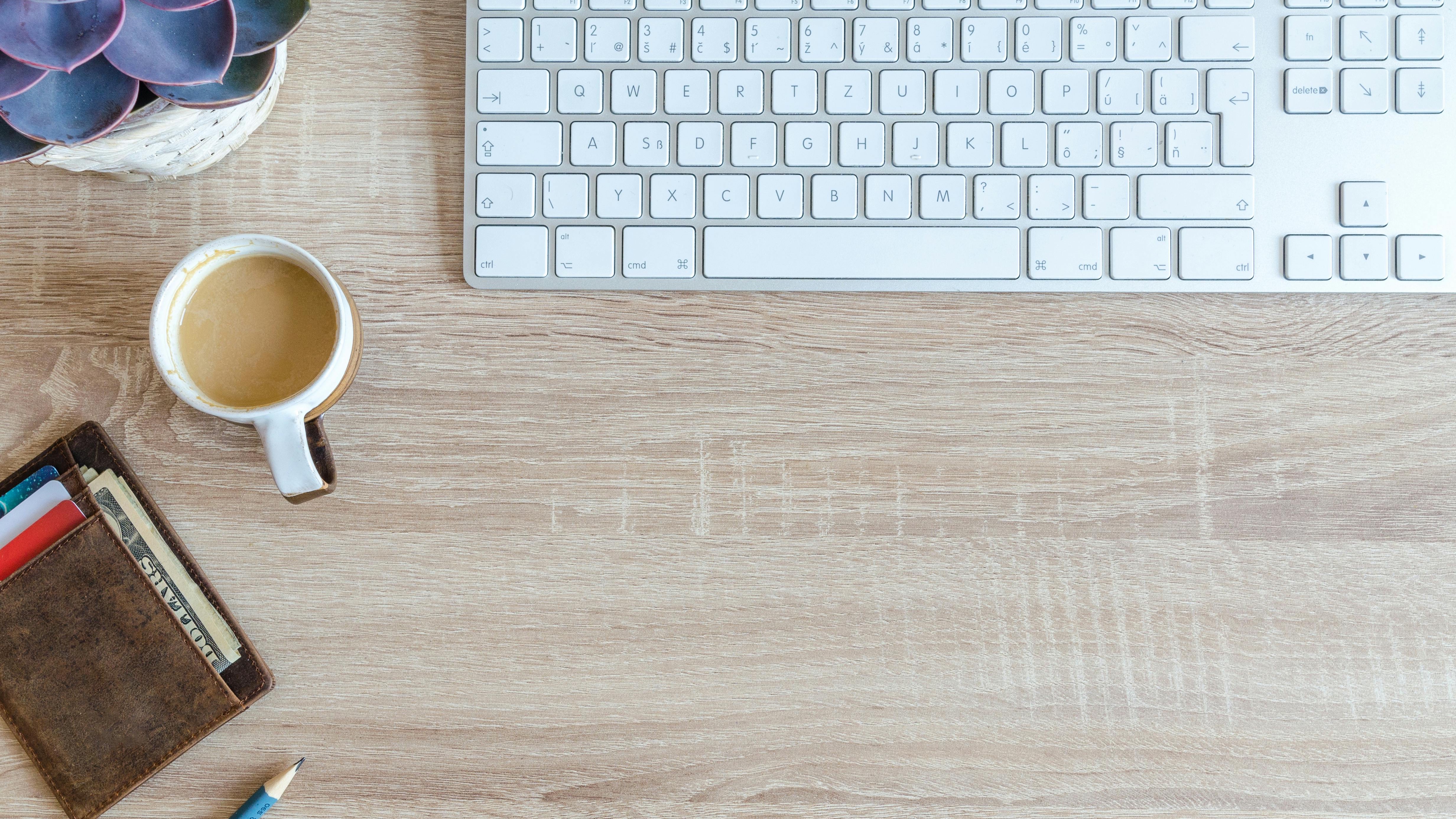 Chic kitchen with green cabinets and warm lighting.