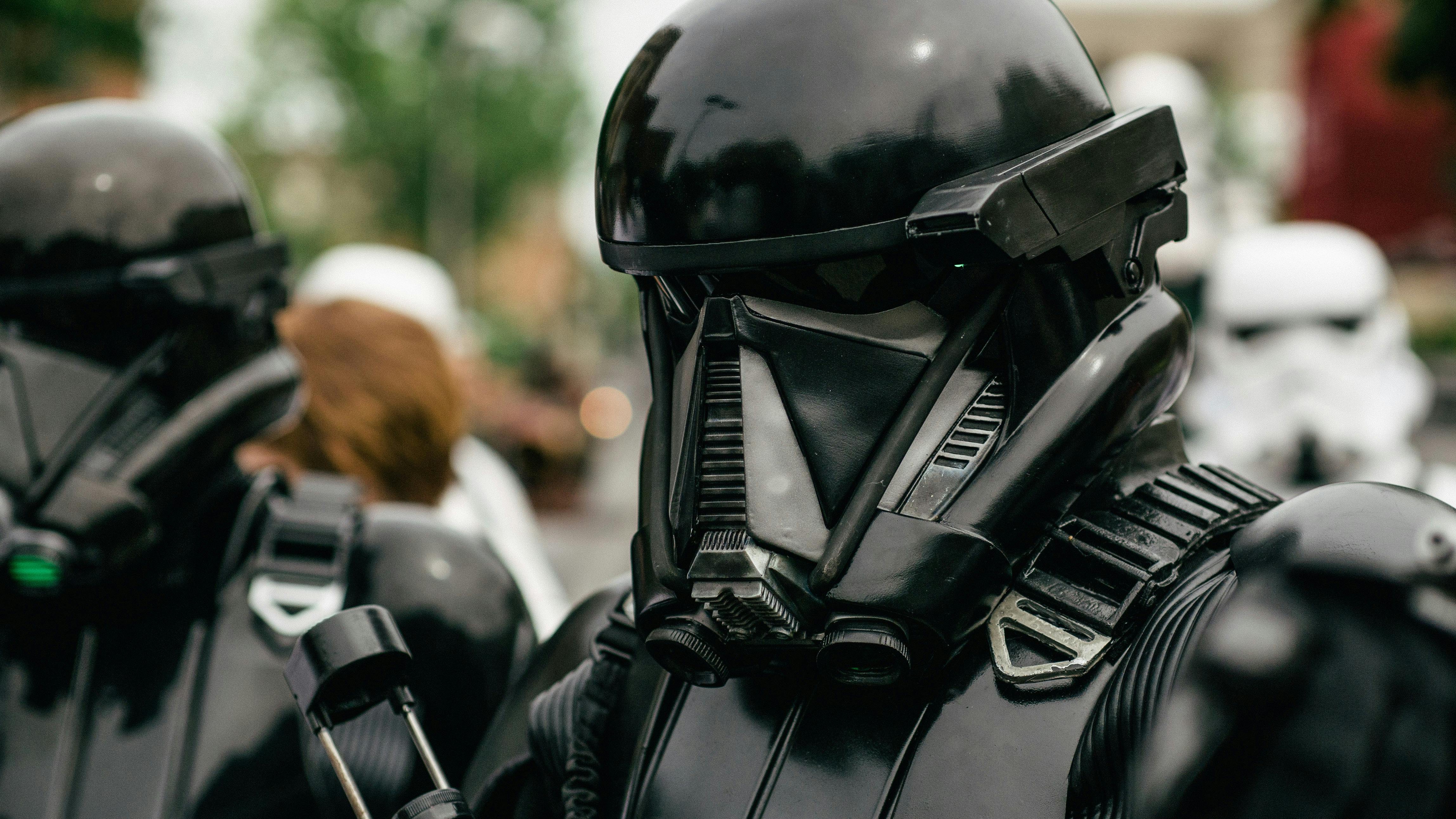 The Mandalorian and Grogu piloting a spacecraft in a sci-fi setting.