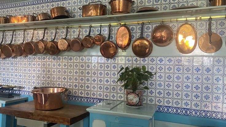 Elegant rustic kitchen with marble and natural light.