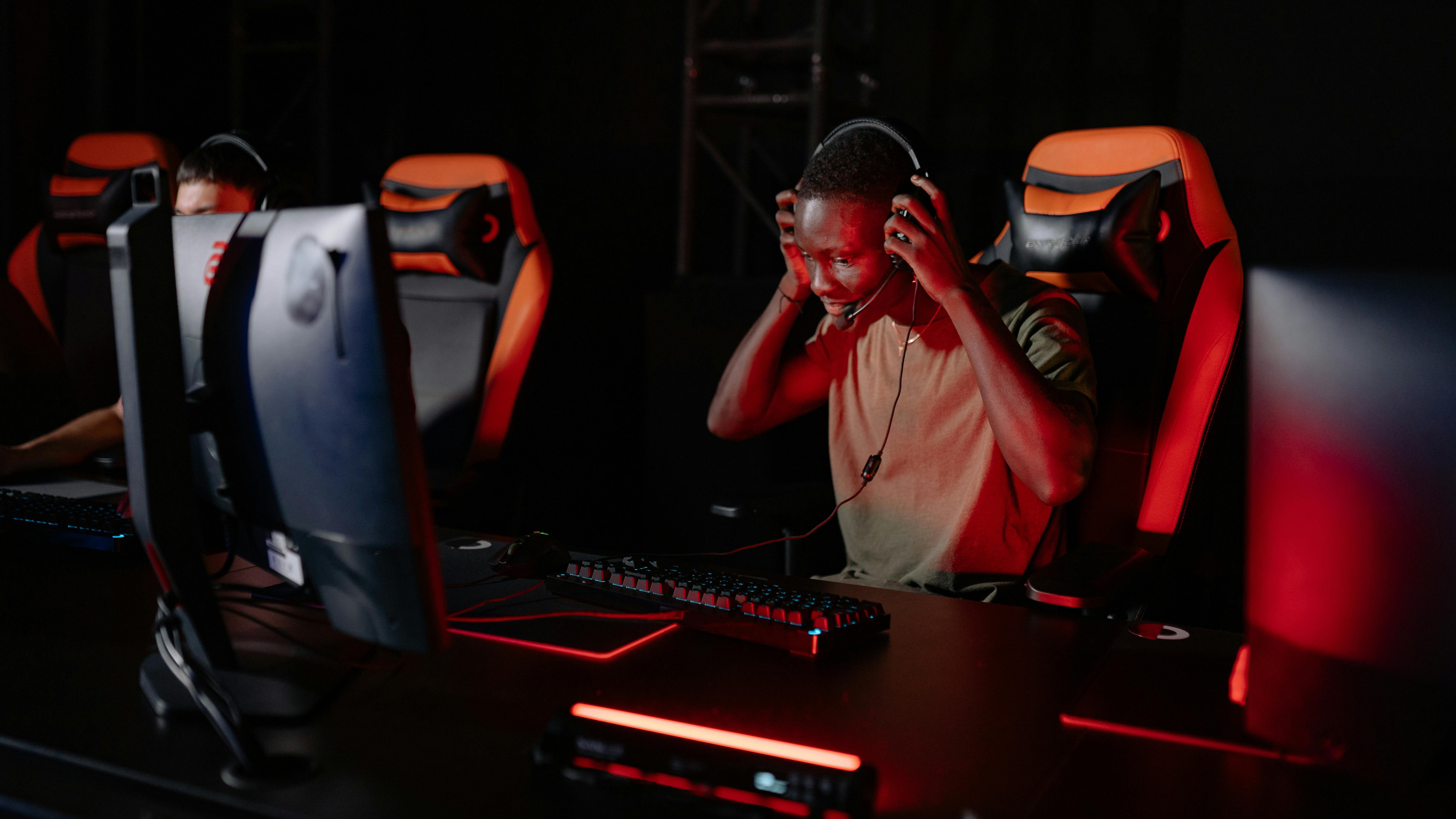 Advanced gaming routers with low latency on an orange backdrop.