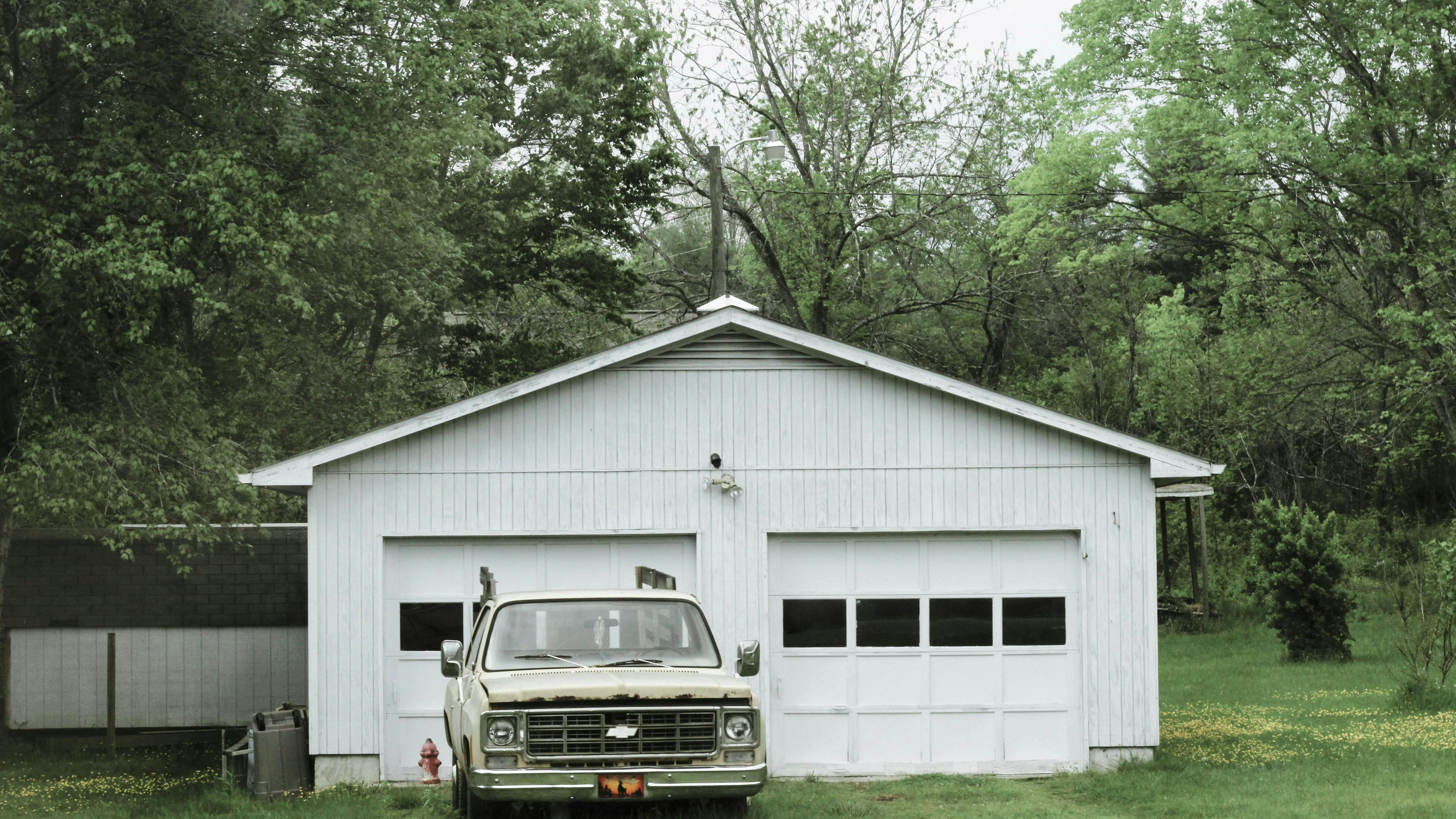 Efficient garage storage systems with white tool chest.