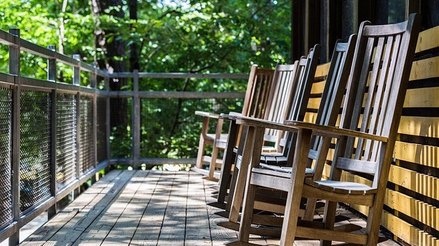 Front porch design mistakes with cluttered decor and a cat.