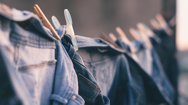 DIY laundry room makeover paint supplies, including a roller set and trays.
