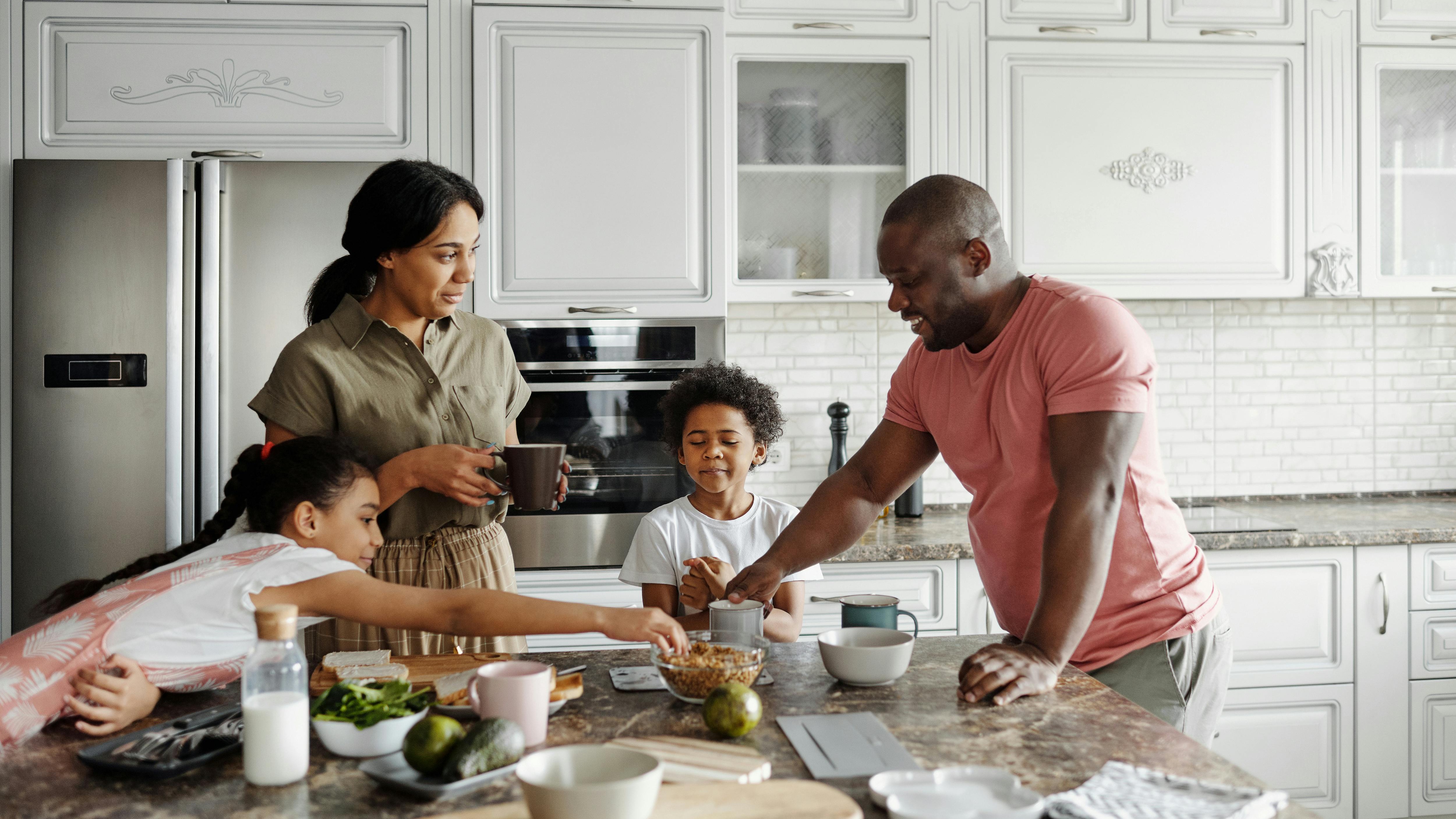 Healthy family meals: kid's plate with fruits, rice, and chickpeas.