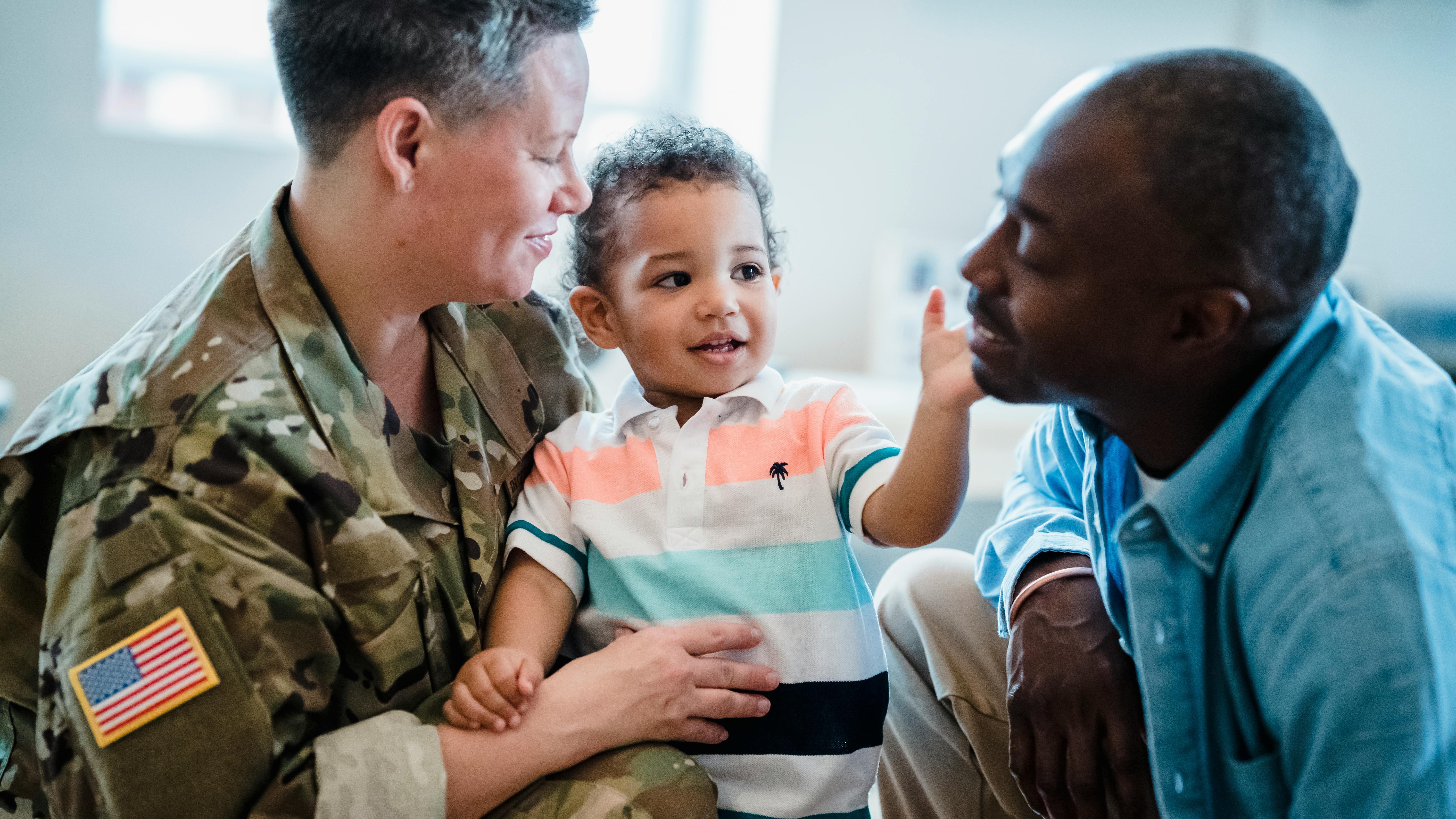 Confident veteran in San Antonio office with military decor.
