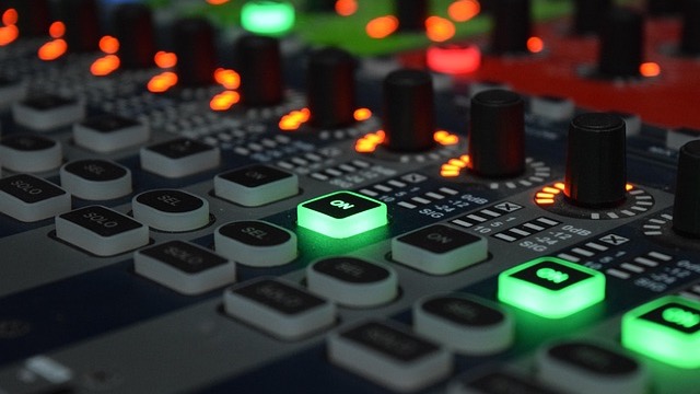 Energetic female DJ performing at a pink-themed event in Omaha.