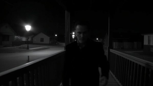 Blurry image of a person walking on a porch at night, Christmas Miracle Kindness.