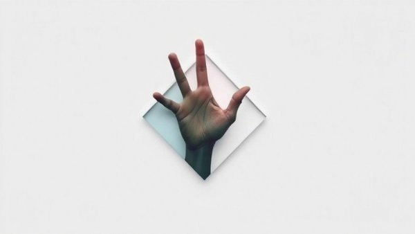 Abstract geometric shape with a hand symbolizes unlocking cryptocurrency wealth in 2025.