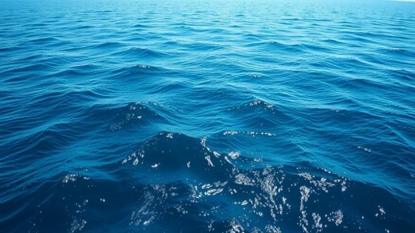 Deep blue ocean waves reflecting light related to Norway's pause on deep-sea mining