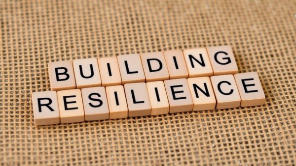 Building resilience concept on burlap background, workplace resilience theme.