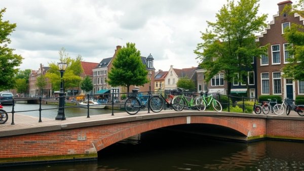 Charming Dutch canal with a brick bridge and traditional buildings.