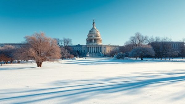 U.S. Capitol in winter with snow and trees, representing DHS funding negotiations backdrop.