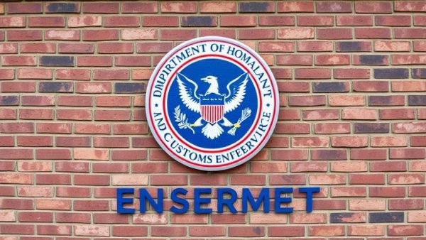 DHS surveillance breach Chicago records imagery: ICE logo on wall.