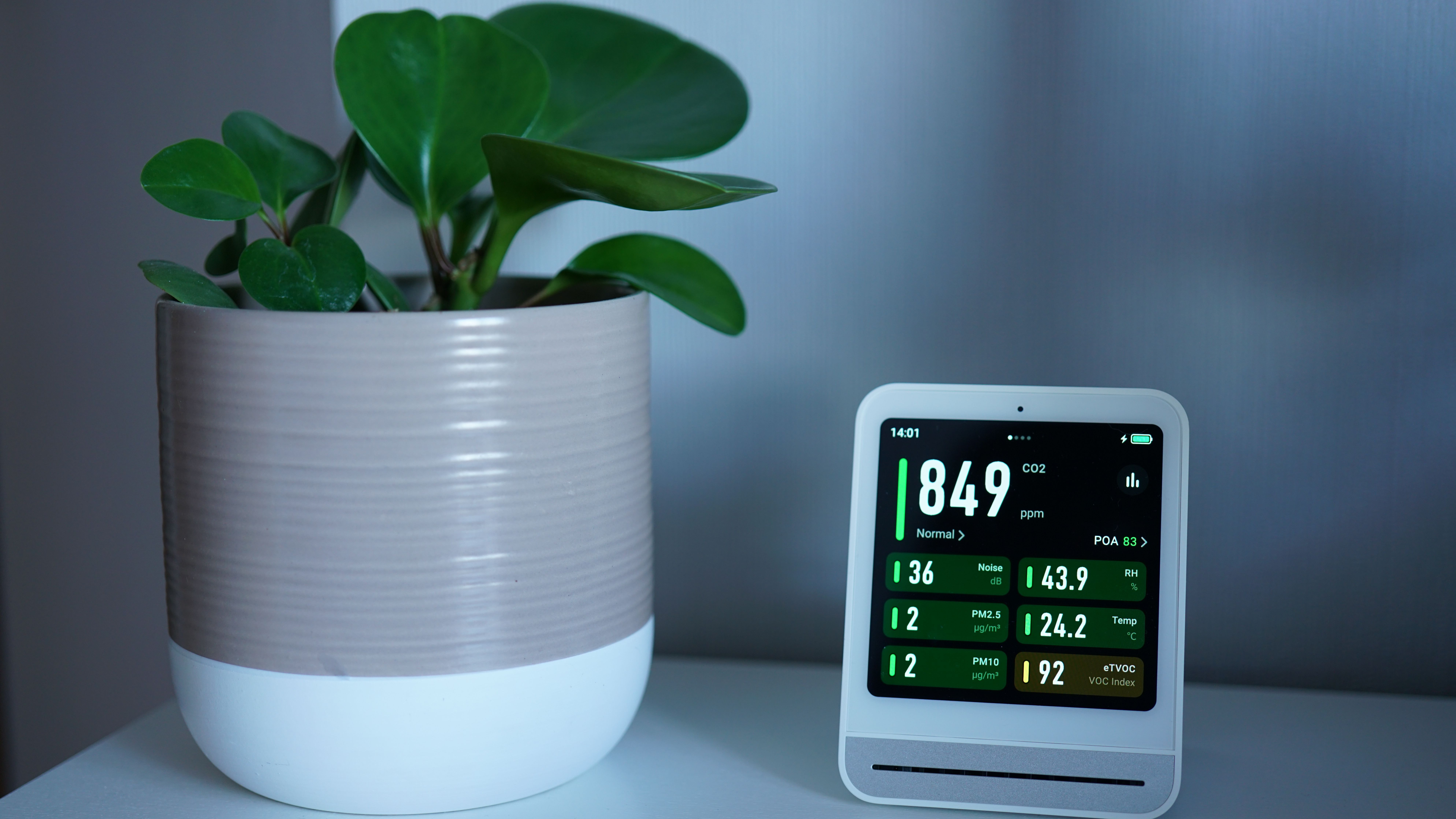 A close-up view of a digital home energy management system displaying real-time power statistics.