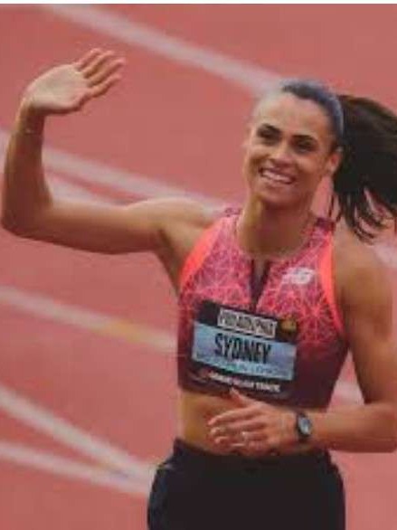 Sydney McLaughlin-Levrone GOAT - triumphant athlete with flag.