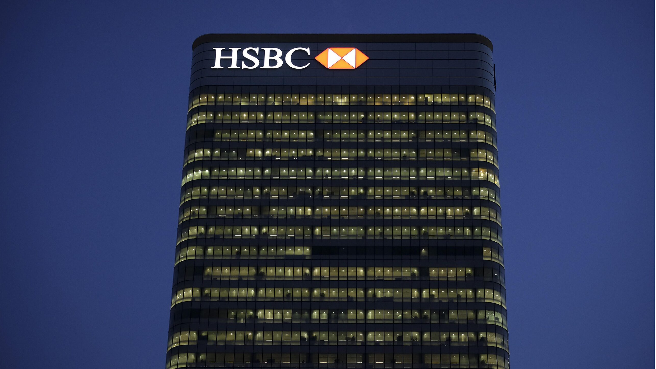 HSBC bank sign exterior, vintage city backdrop.
