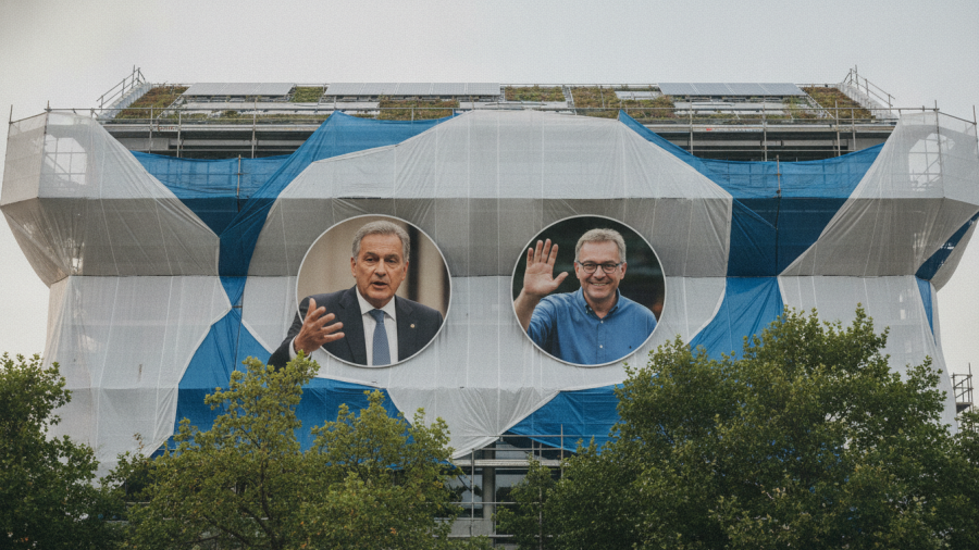 Modern building facade with portraits highlighting artistic expression in politics.