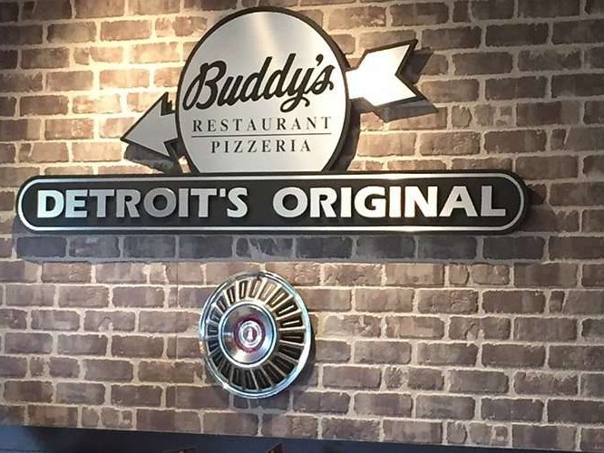 Buddy's Pizza sign at West Michigan location closing.