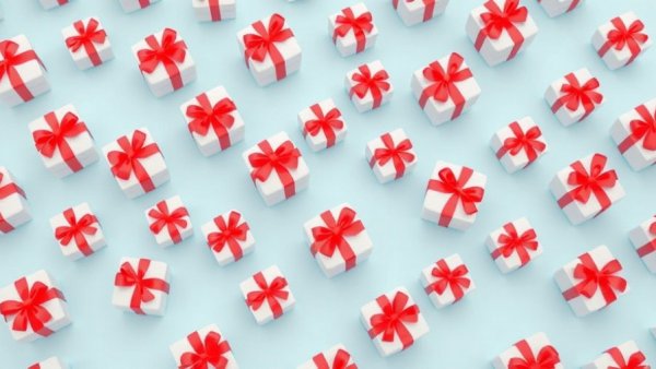 Multiple gift boxes with red ribbons on blue background.
