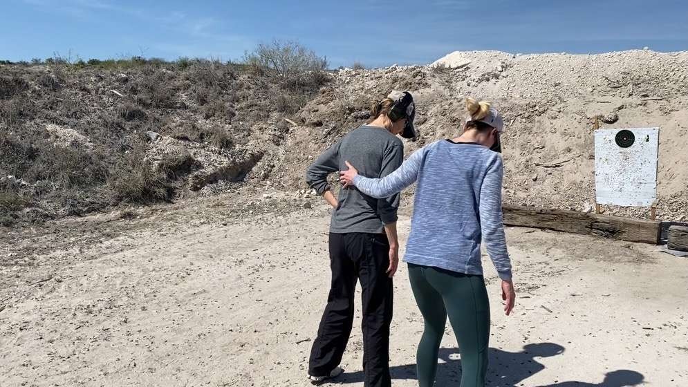 Sleek athletic woman wearing concealed carry leggings with side pockets on outdoor trail