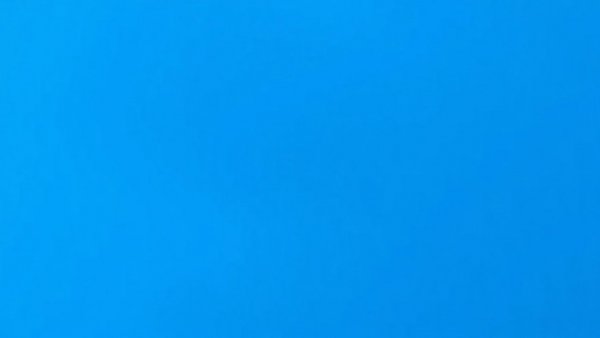 Vibrant blue background, plain and smooth, no features.