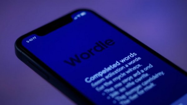 Close-up of smartphone showing today's Wordle hints and answer.