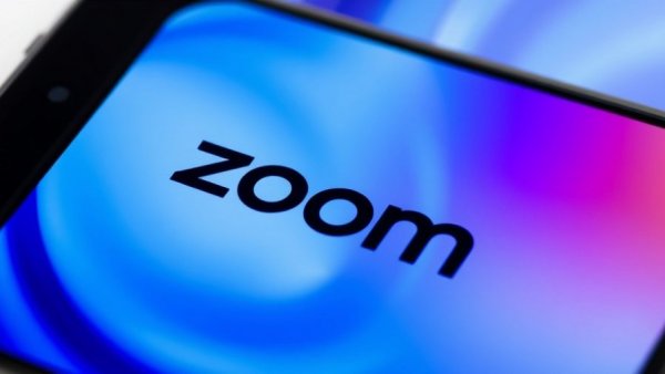Close-up of smartphone with Zoom logo symbolizing business growth.