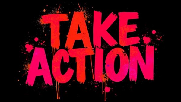 Vibrant 'TAKE ACTION' spray paint protest message.