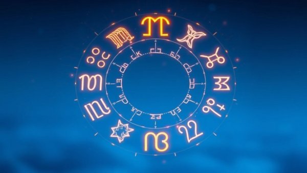 Glowing zodiac symbols circle on blue background representing New Moon in Pisces.