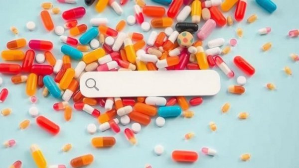 Multicolored pills and capsules with search bar, peptides in wellness clinics.