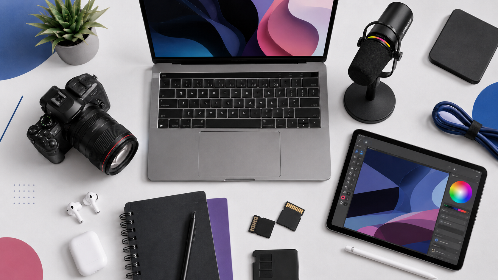 Essential content creation tools for bloggers: laptop, camera, microphone, tablet with design app in a neat workspace