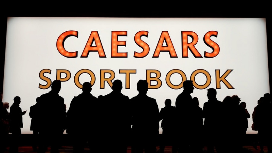 Silhouetted figures by Caesars Sportsbook sign, highlighting gambling impact on NBA integrity.