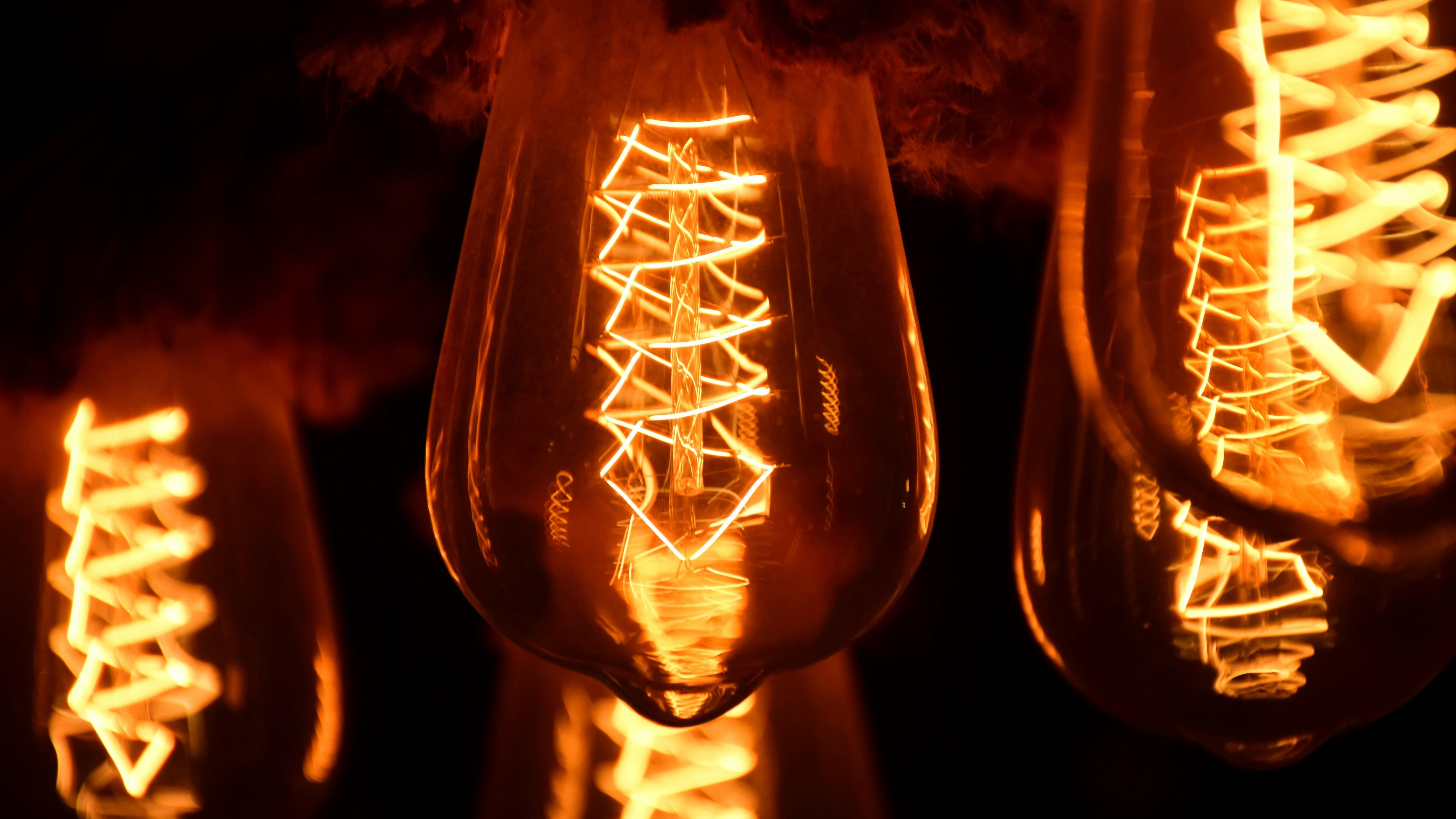 electrician installing a circuit, focused, connecting wires to a panel, photorealistic, in a modern living room, highly detailed, sparks flying with intricate wiring, 24-bit color, bright task lighting, shot with a 35mm lens.