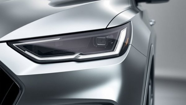 Luxury SUV headlight close-up with modern LED design.