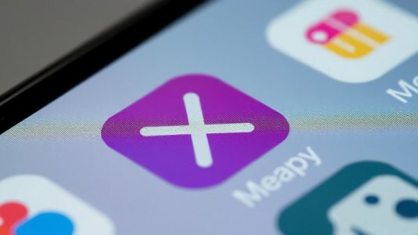 Close-up of social media app icons on screen, featuring X logo.