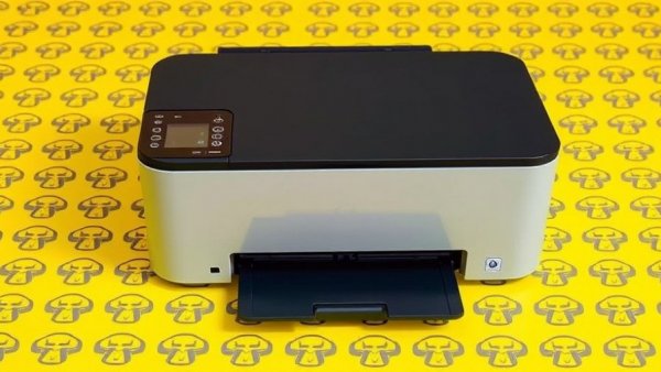 Modern portable printer against yellow background, highlighting health technology.